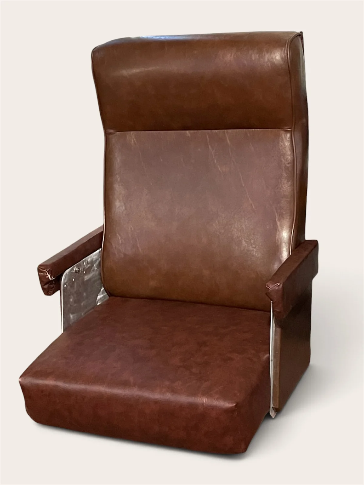 After: finished brown captain’s chair against a plain background